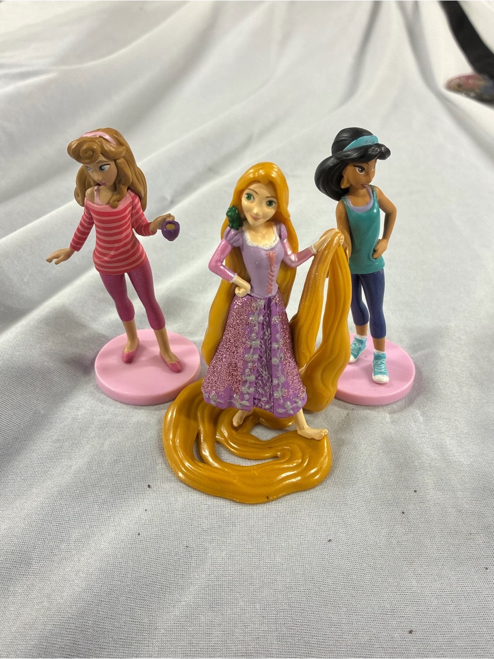 Aurora, Rapunzel, and  Jasmine Princess figures